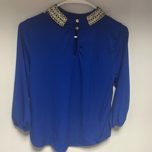 Elegant Blue Women's Top with Gold Accents